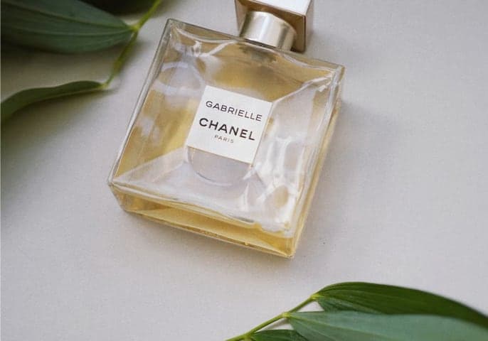 elegant, square-shaped perfume bottle with Gabrielle and CHANEL wordmarks